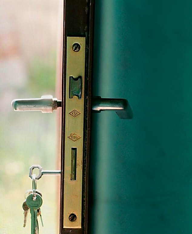 Puerta con llaves, representando la Cobertura Oro